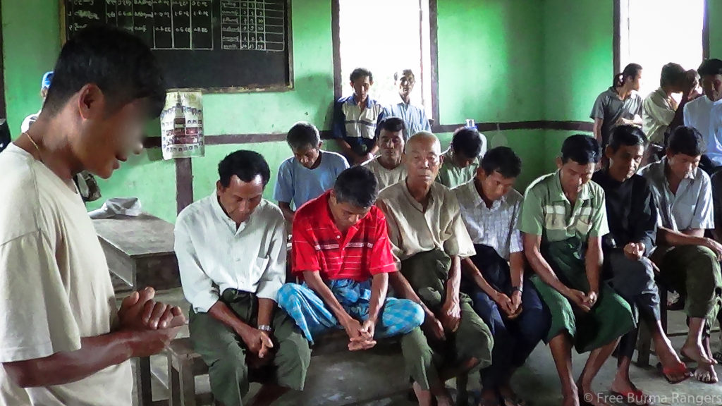 An FBR team leader commences a relief program by opening with a prayer for the people of Arakan State.