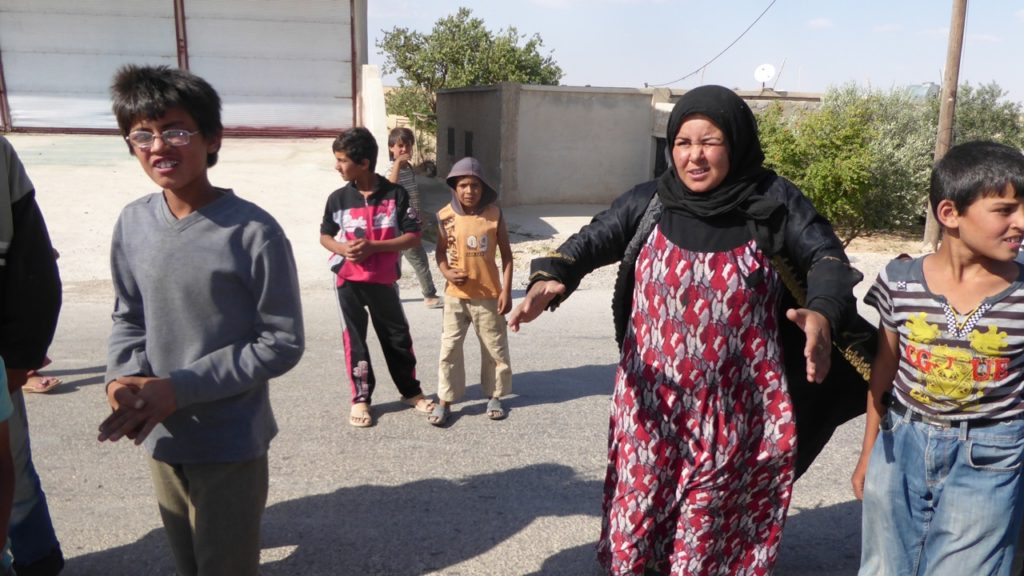 Mother begging for food near the front line