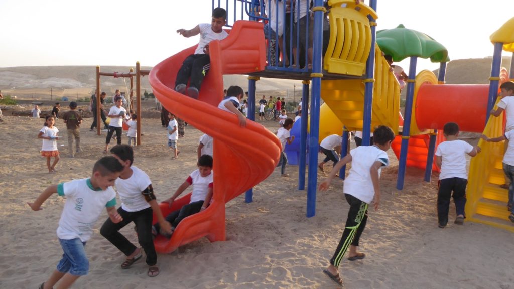 Dedicating the new playground. The children loved it!