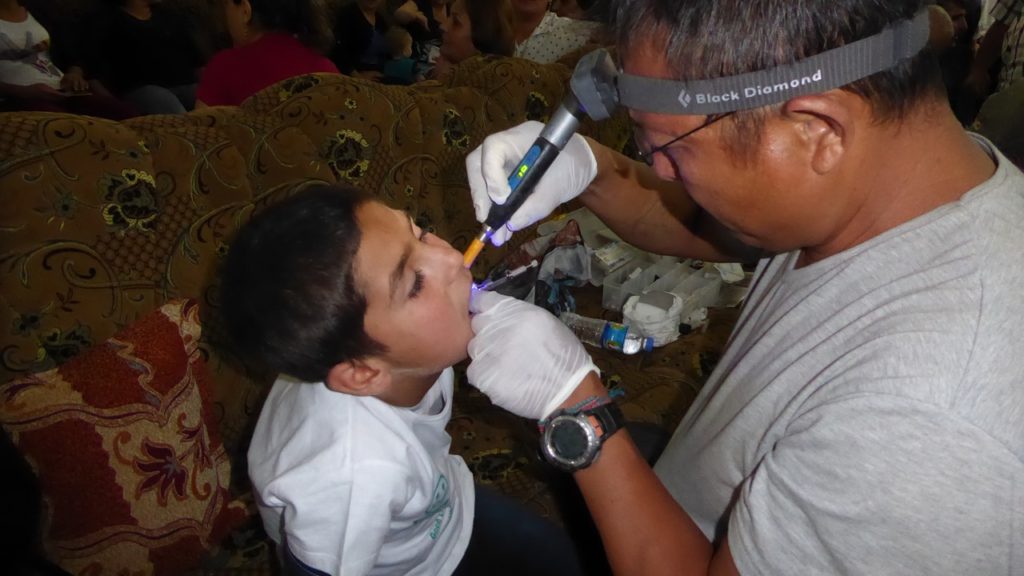 Eliya provides dental treatment to Mirky children.