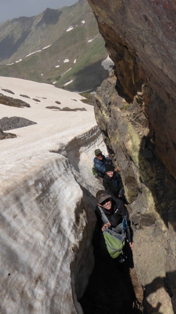 The team navigating between ice and rock.