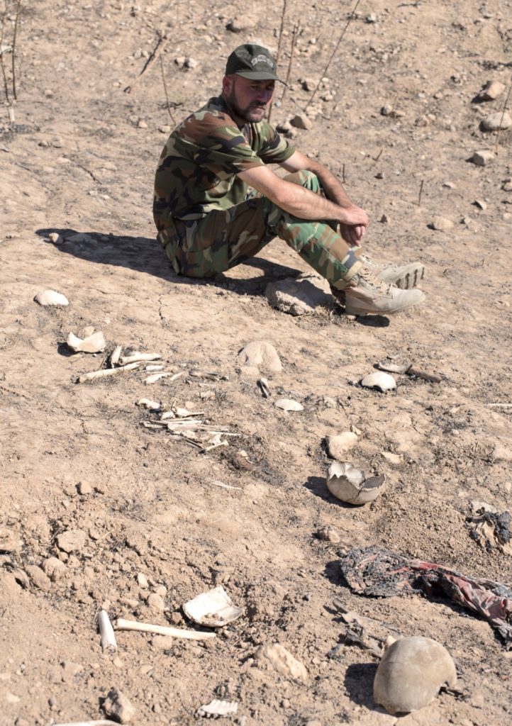 Nezar Samuel at mass grave where many of his family were killed