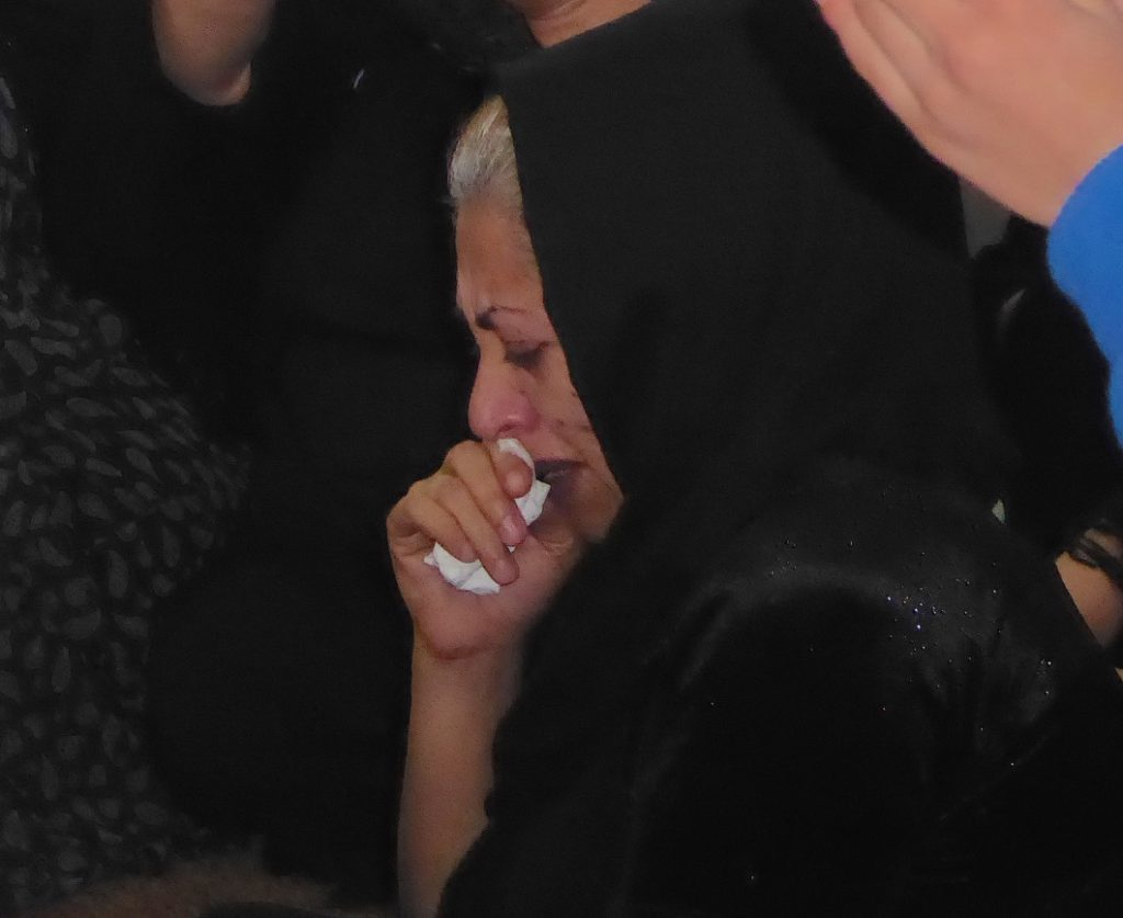 Sister of General Shawkat mourning his loss and standing behind the Peshmerga