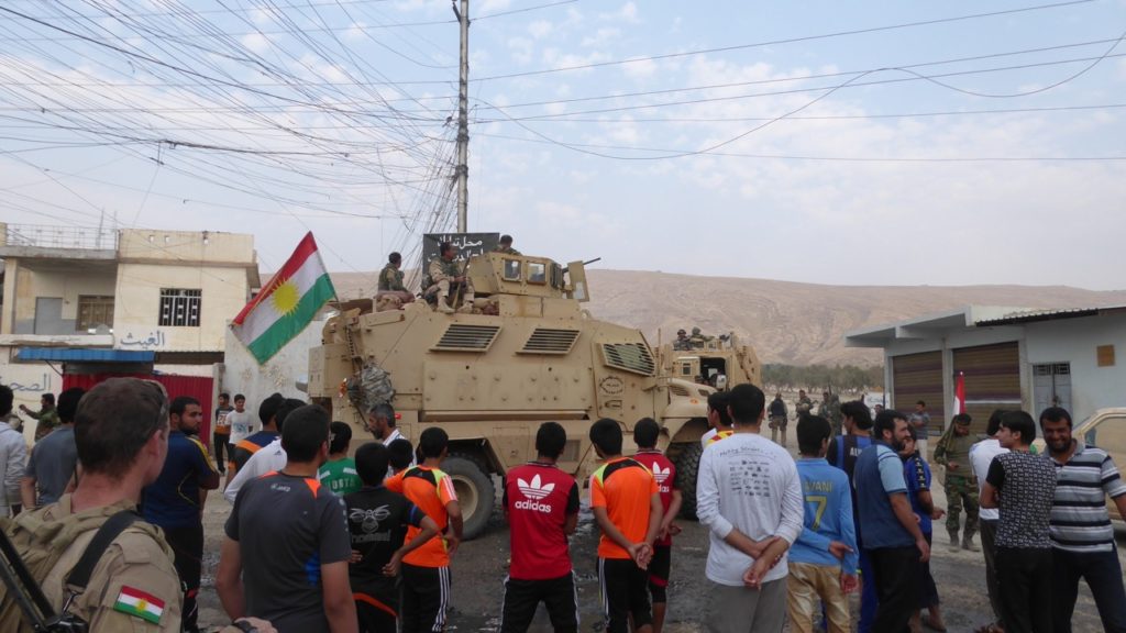 Townspeople welcoming the Peshmerga.