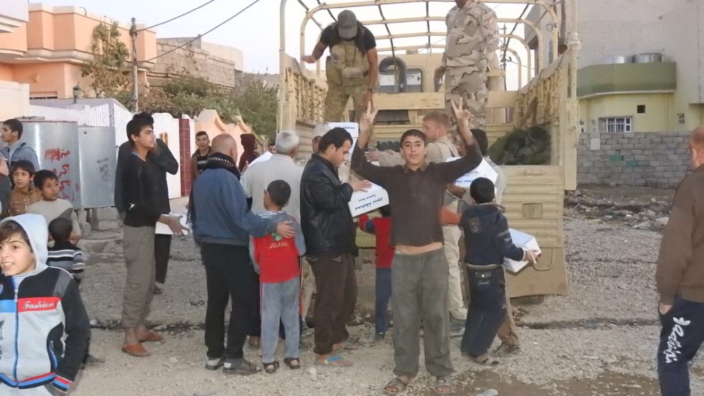 Aid delivery in a liberated neighborhood. Photo: FBR. 