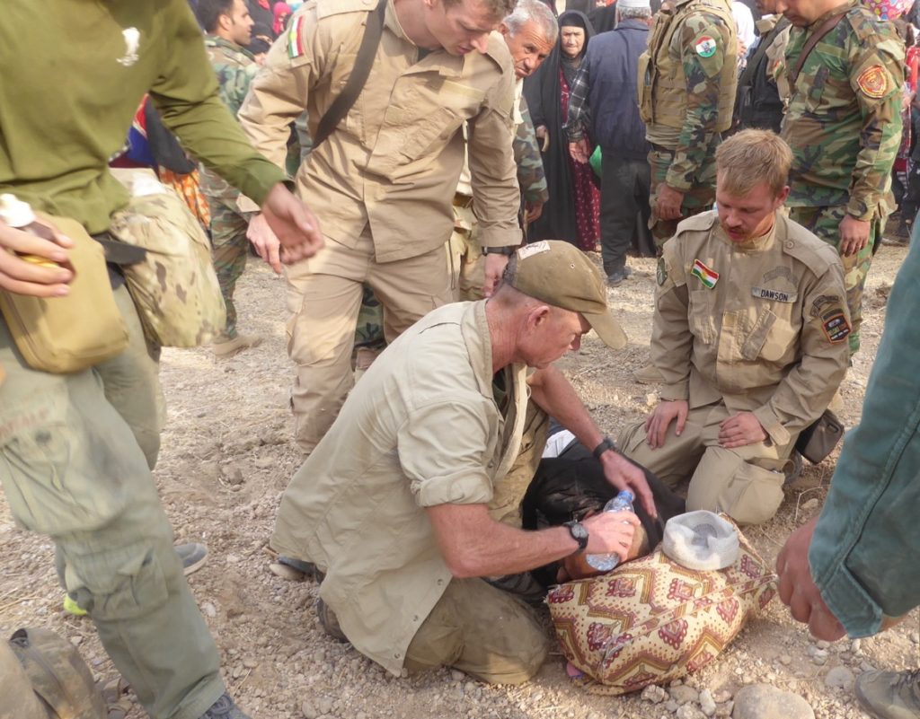 Treating a man who had collapsed in the camp. Photo: FBR. 