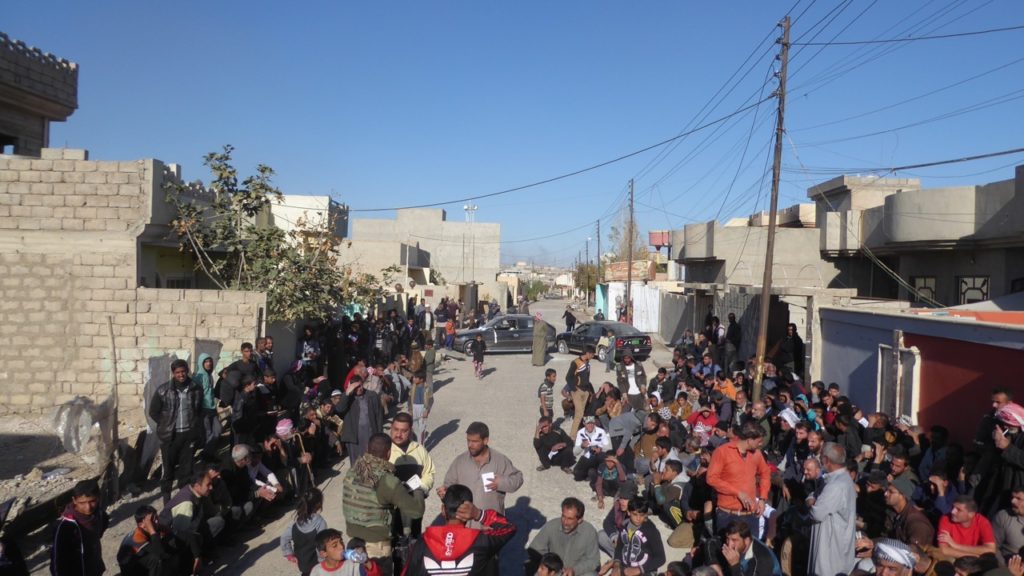 Distribution of aid outside of where ISIS attacked our position the day before. Photo: FBR. 