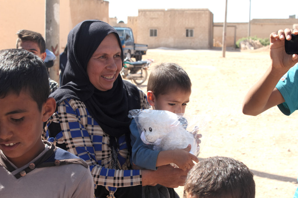 Women and children gather for a GLC event in Mambij. Photo: FBR.