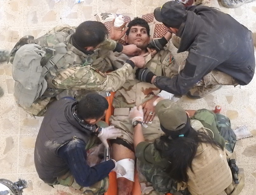 Iraqi soldier wounded by sniper fire.