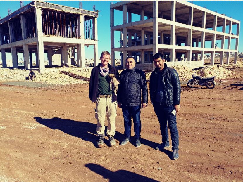 The new orphanage and school being built, Praying a playground can be made there.