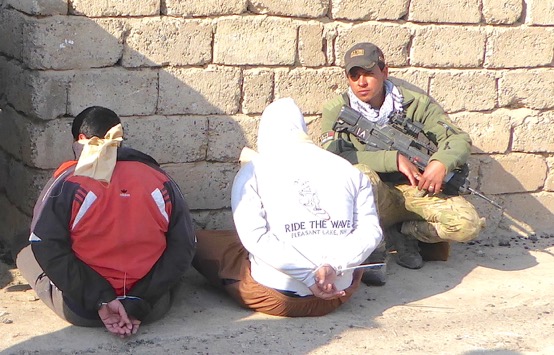 ISIS captives with Iraqi forces near Tigris River.