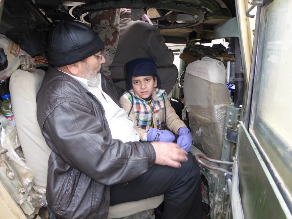 Rescued, Ayman Amin in Iraqi Humvee with man who purchased him. Photo: FBR.
