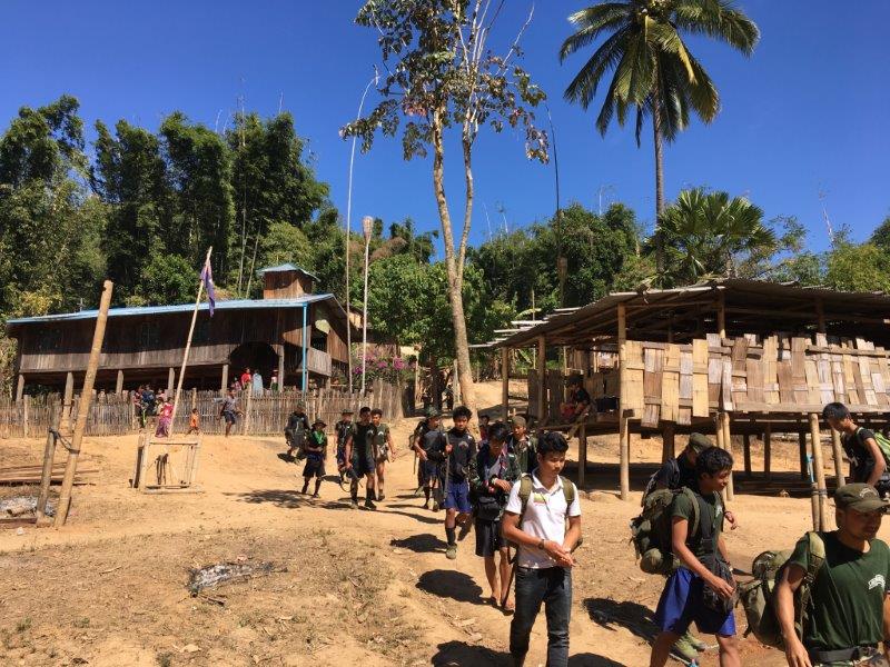 Rangers on the trail through jungle villages
