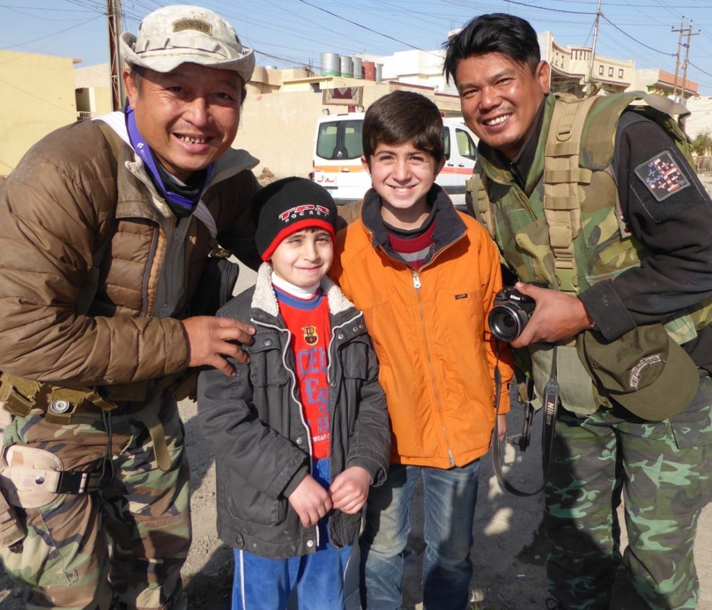 Eliya, left with Mosul children and Zau Seng FBR Kachin video man