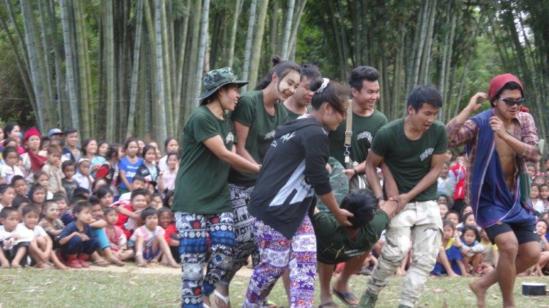 Rangers perform a drama about health to villagers