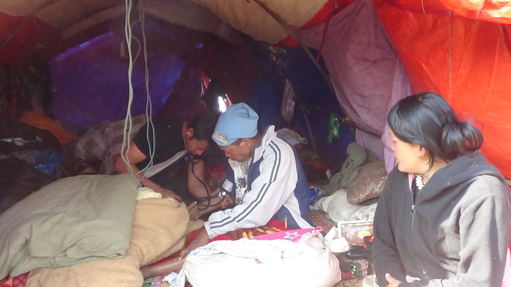 Karen medic treats IDP in her home
