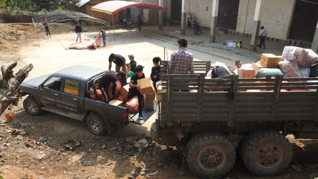 Loading up food and medicine to go to Sha It Yang