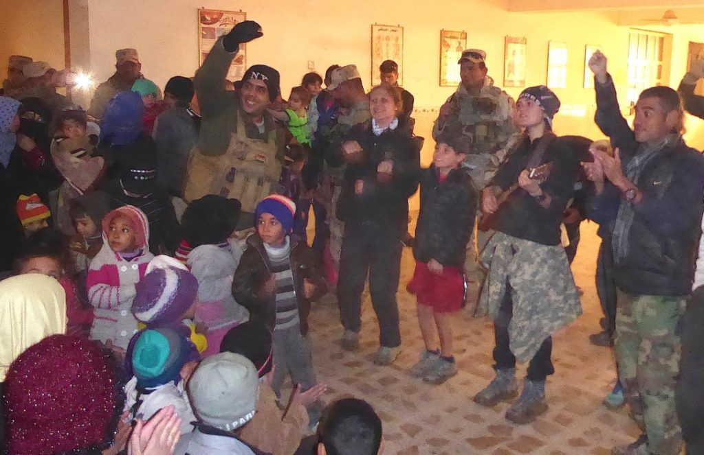 Iraqi soldier helps lead children’s program in east Mosul