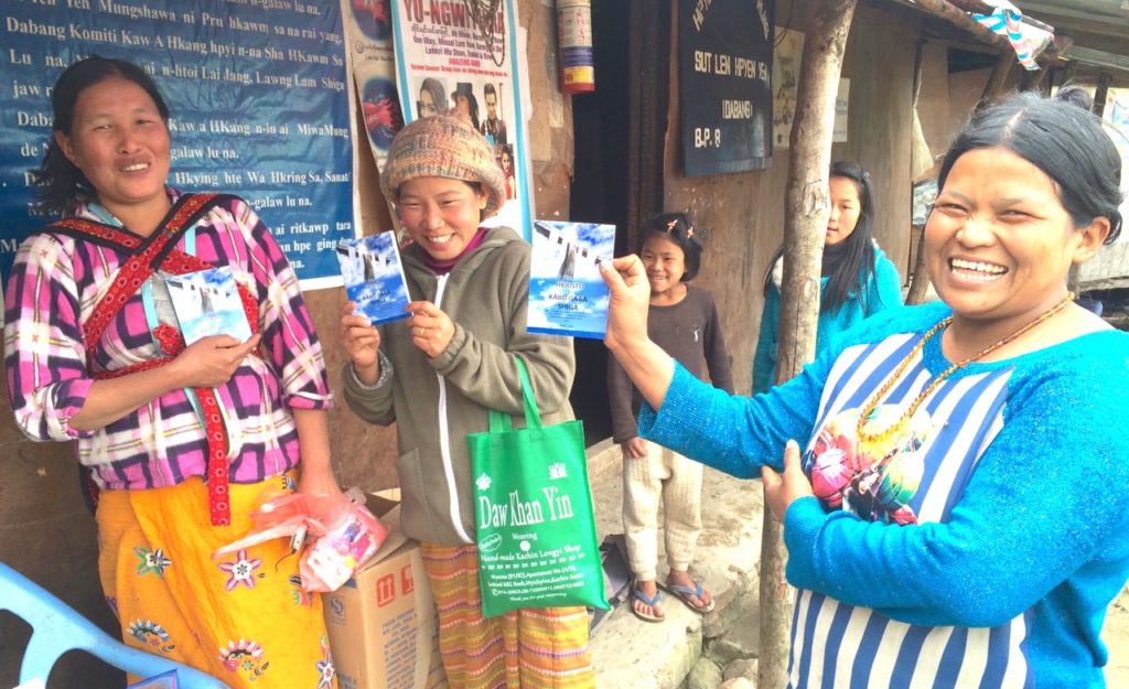 Kachin Christian IDPs with gospel tracts we gave them in a camp where they fled from the attacking Burma Army