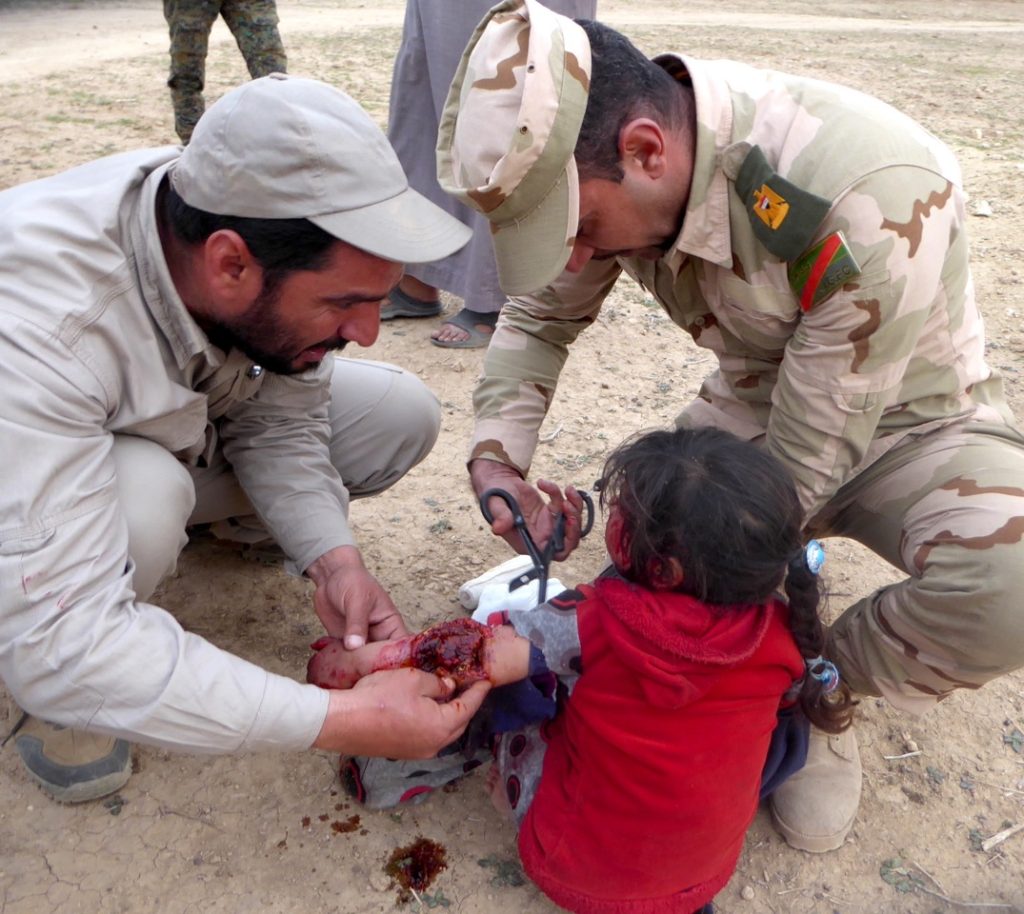 Major Naseem and Iraq Militia (PMU) treat child wounded by ISIS landmine in west Mosul