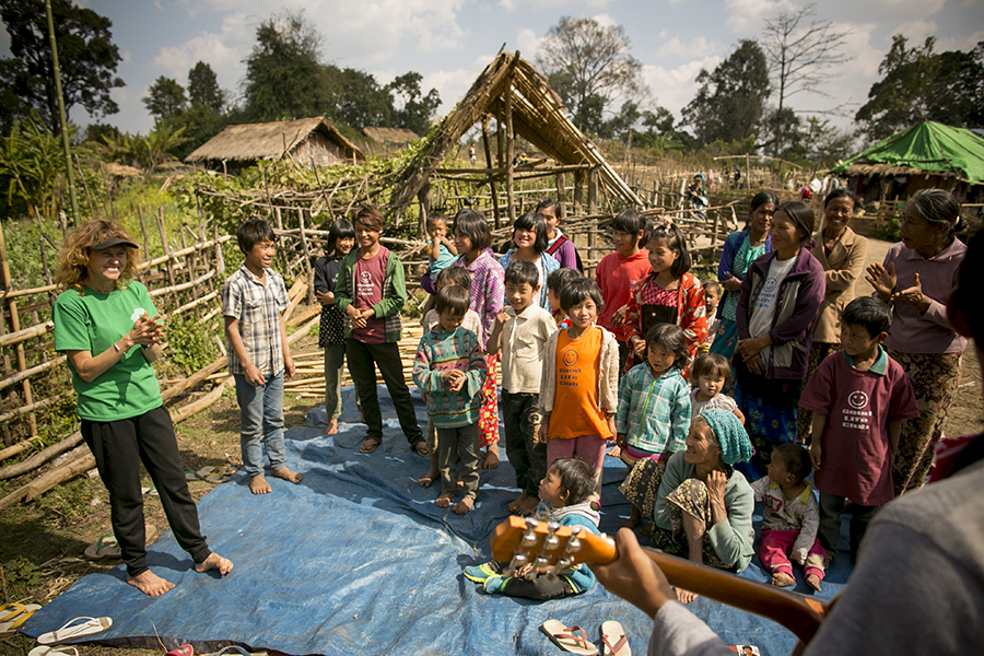 Karen Eubank teaches children the song "Deep and Wide" during a Good Life Club program for villagers in northern Shan State, Burma.