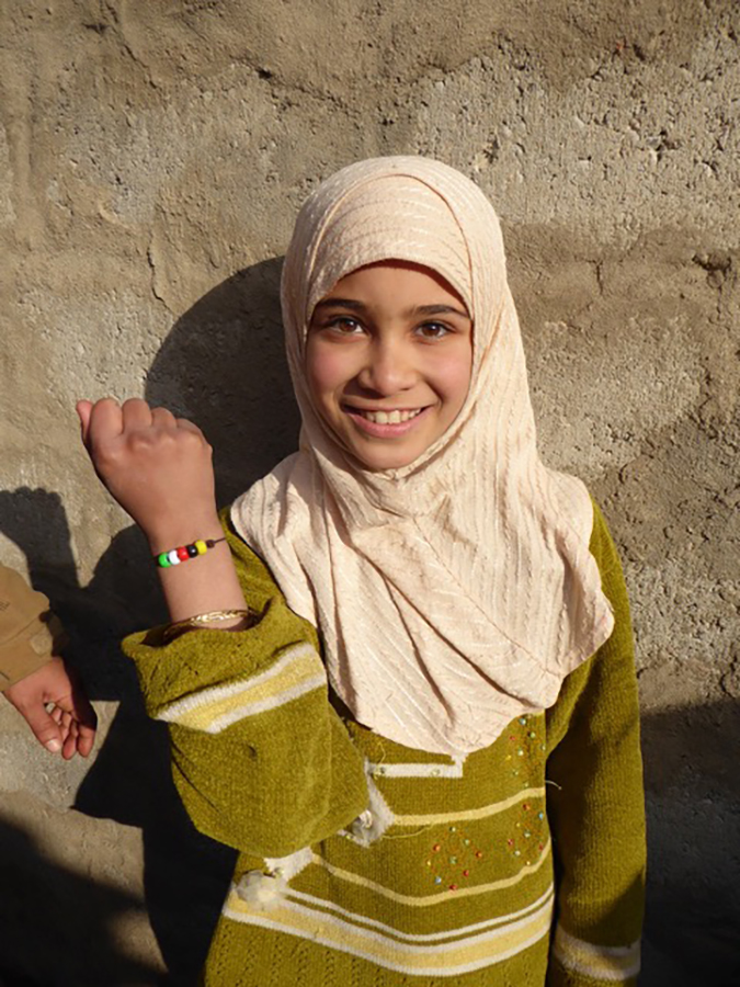 An Iraqi girl shows off her new GLC bracelet about Jesus’ love in newly liberated eastern Mosul.