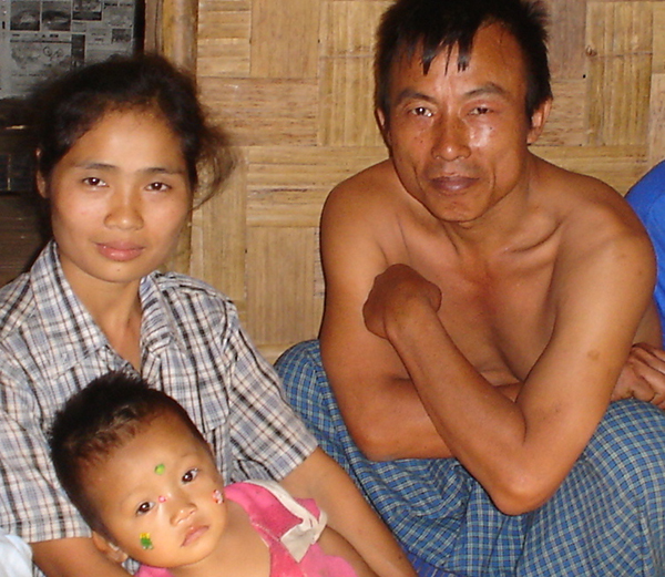 Mucu, his wife, and one of his children in a Karenni refugee camp in Thailand 2000.