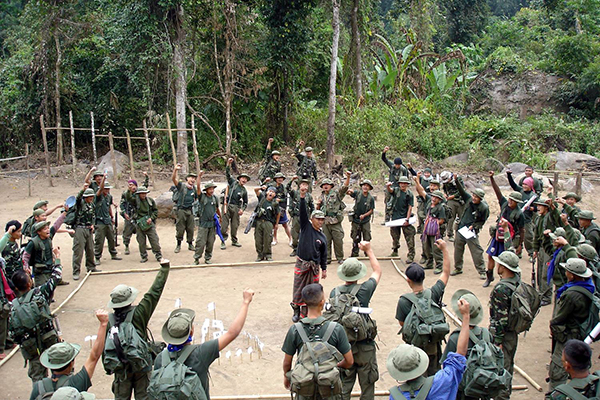 Mucu, center, leads new rangers in Tha U Wa camp, Karen State, Burma, 2003.