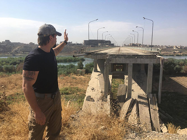 Sky points to a bombed out hospital on the Western bank of the Tigris, formerly an ISIS stronghold.