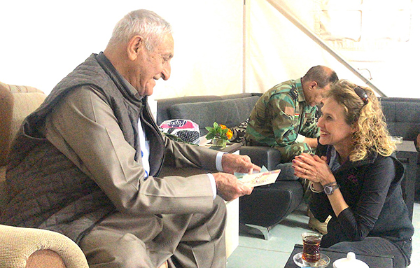 Karen gives gift to Kurdish General Hamid Alfandi.