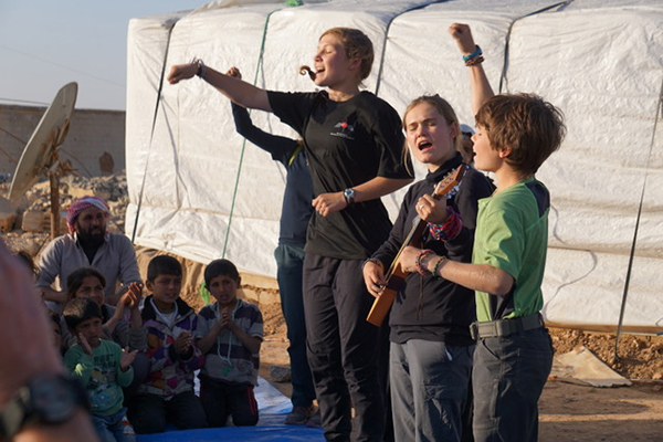 Kids sing at GLC program outside Raqqa.