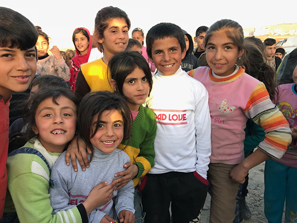 Children at the program with new shirts from Reload Love.