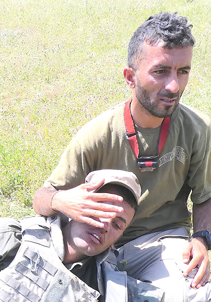 Shaheen taking care of a wounded Iraqi soldier one hour before he was killed saving Aisha and her father on 4 May 2017.