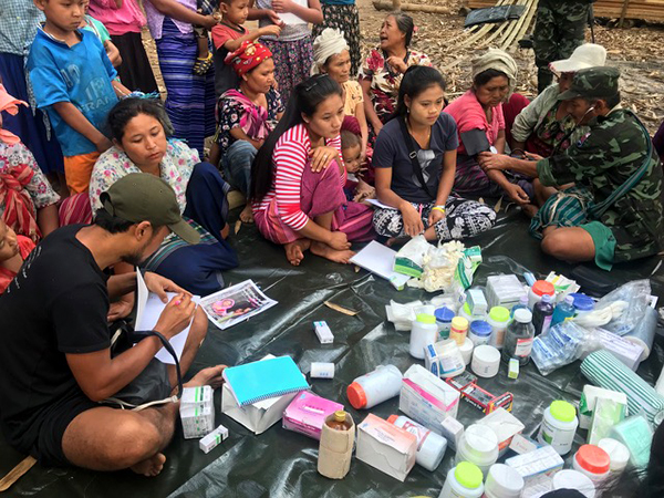 Medics treat sick villagers.