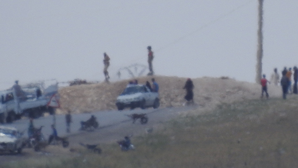 FSA militants on their position north of Menbij.