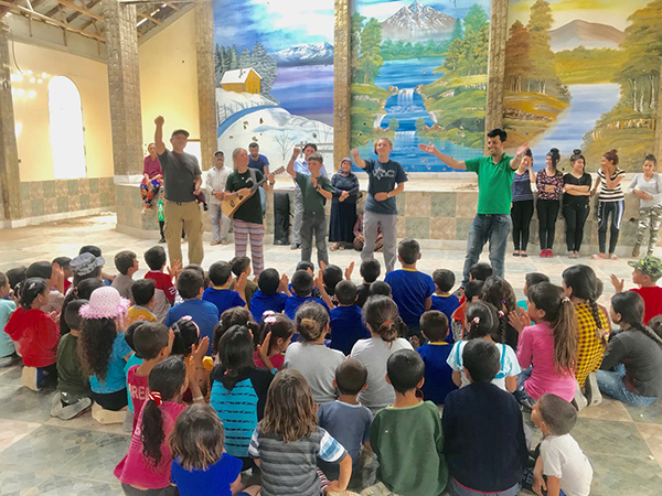 Members of the FBR Iraq and Syria team sing "Yezidis Lead the Way” during the GLC program.