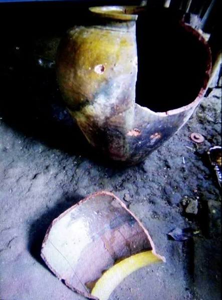 A jar broken by the shrapnel.