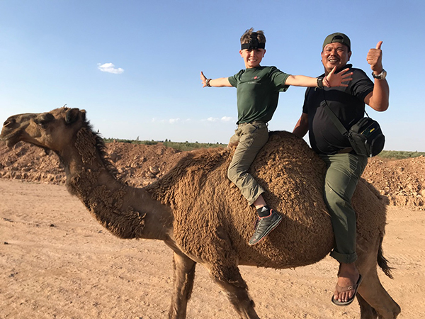 Zau Seng, a Kachin teammate from Burma, with Pete on a friend's camel on the way to Dier Ezoir