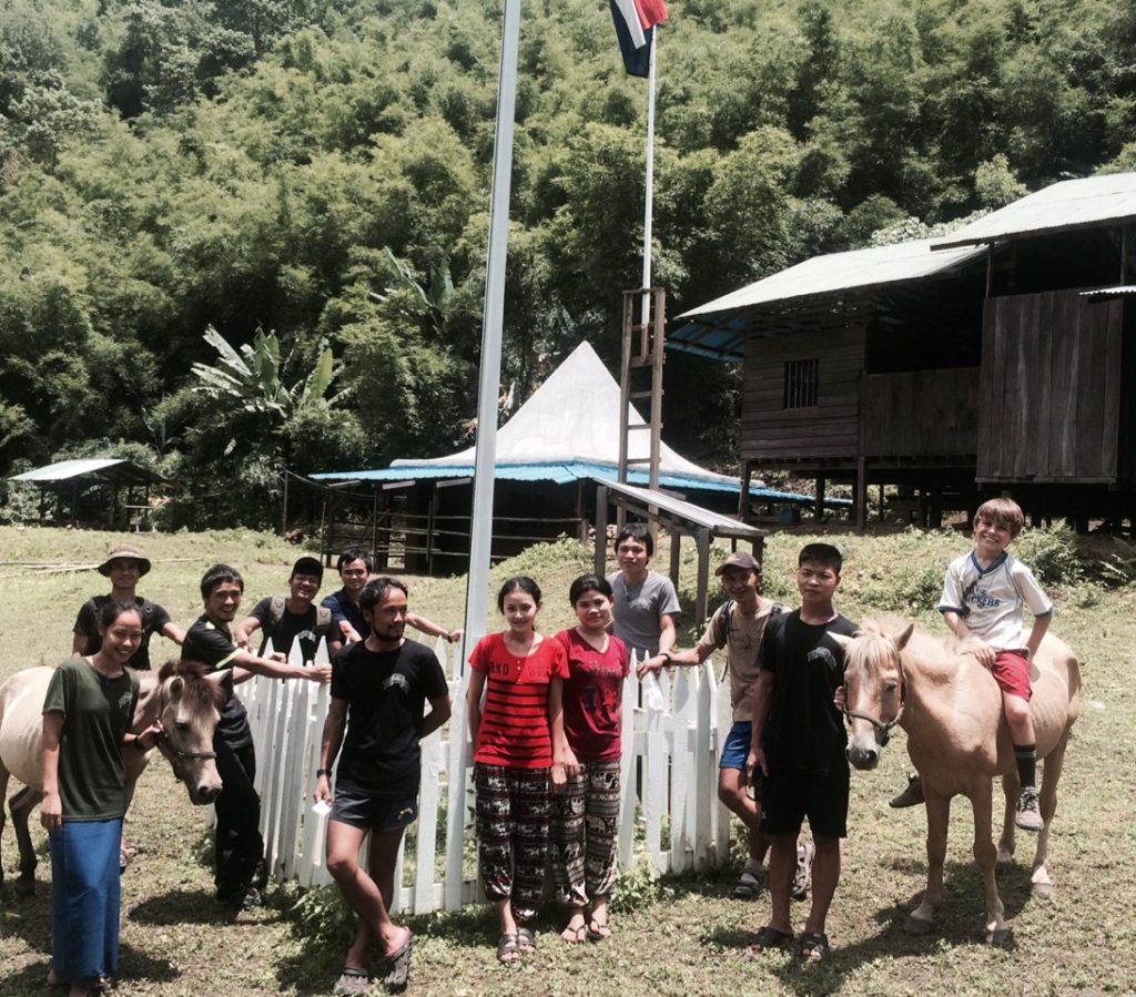 Medics in front of the clinic and school