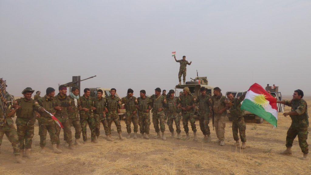 Kurdish Peshmerga celebrate after liberating Omar Qamshi Photo: FBR