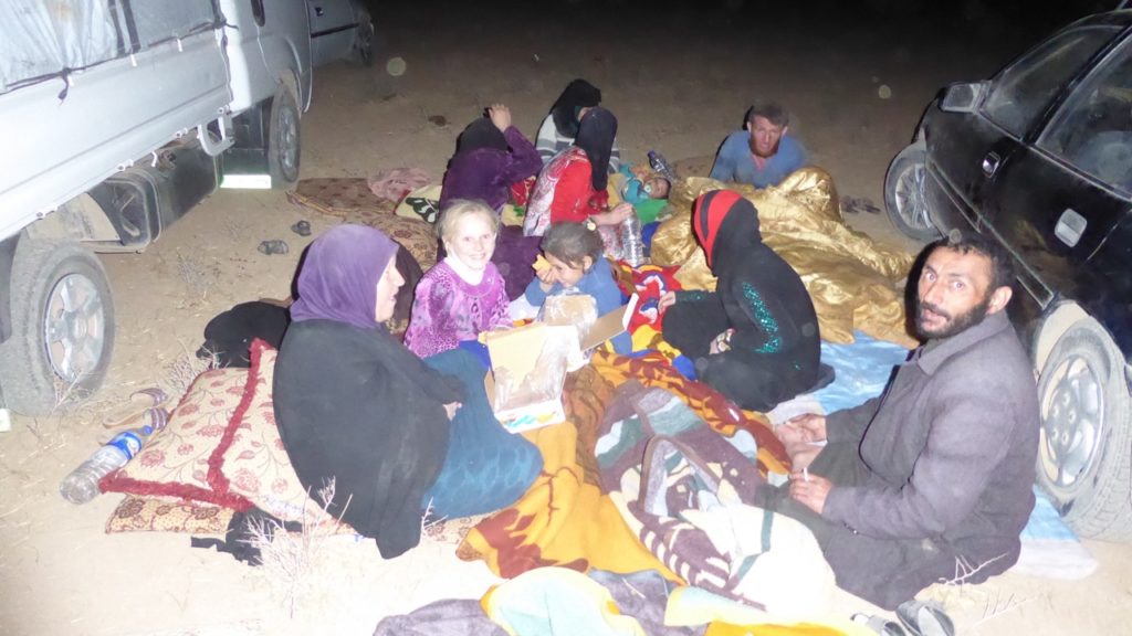 A family gathers around their supplies. Photo: FBR.