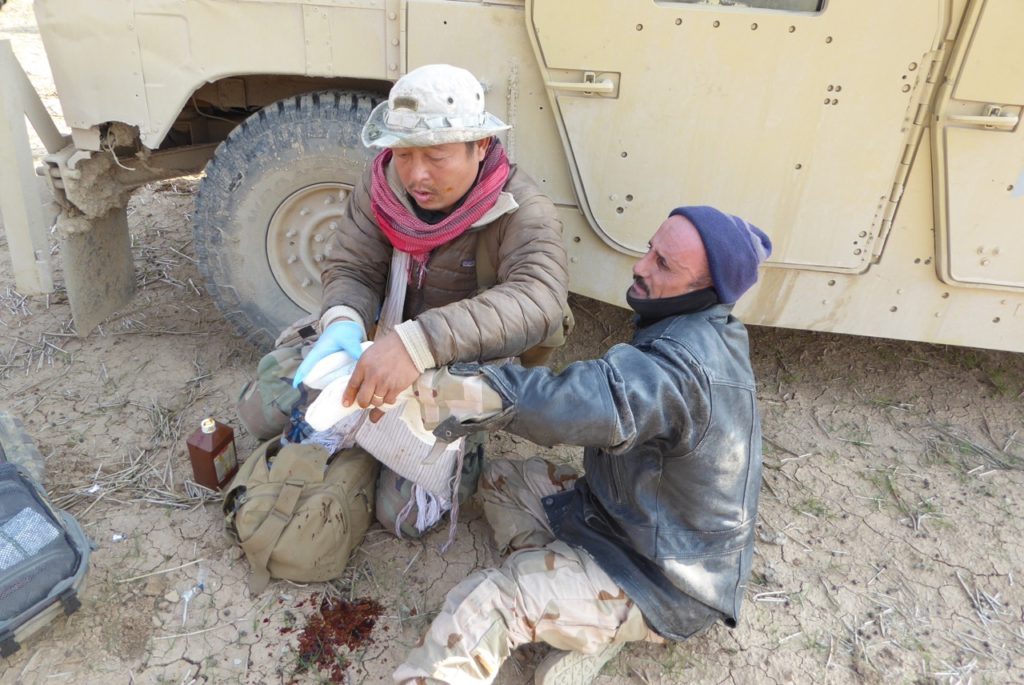Eliya treats man shot in the hand by ISIS as we move to NE Mosul 
