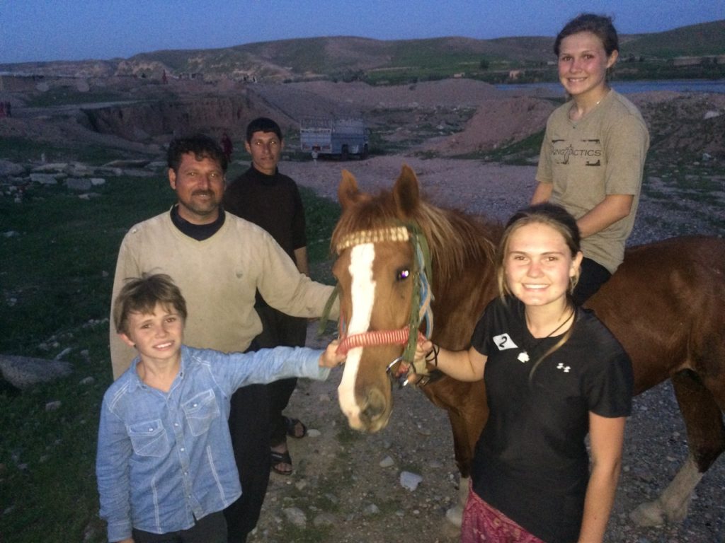 The horse back with his owner and the end of a good day, Easter in Iraq