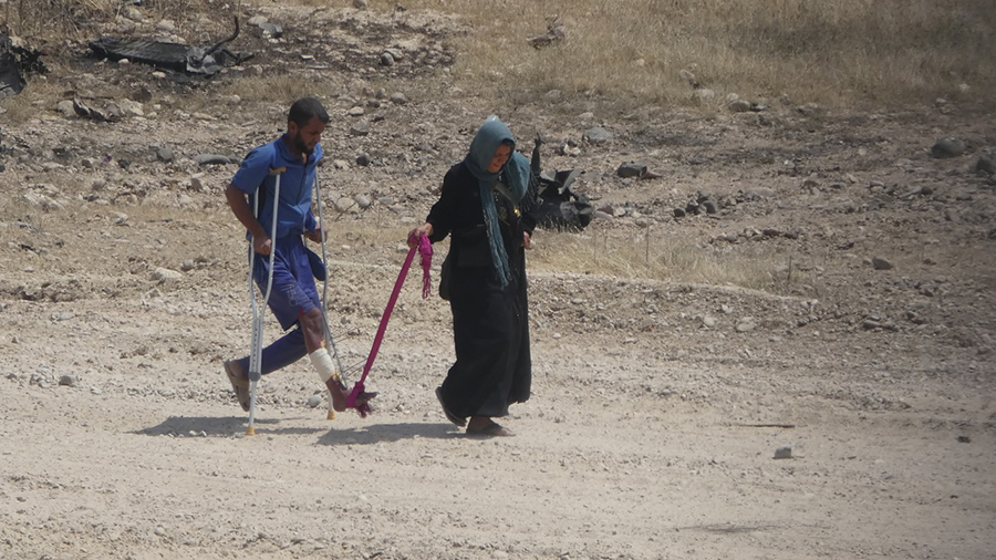 Wife helps her shot husband flee.