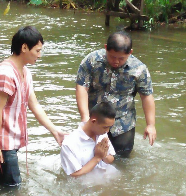 Suchat is baptized.
