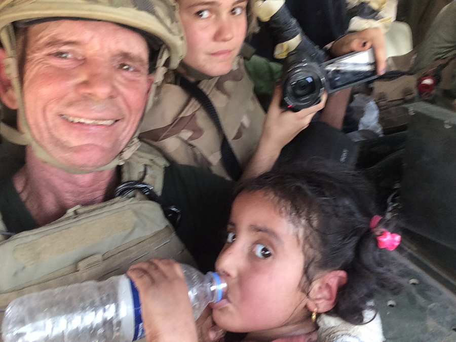 In the Humvee with the girl after the rescue.
