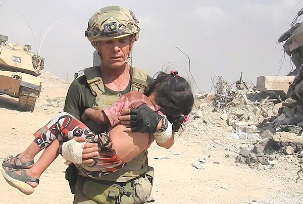 Dave with girl rescued from ISIS kill zone, Mosul, 2 June 2017.