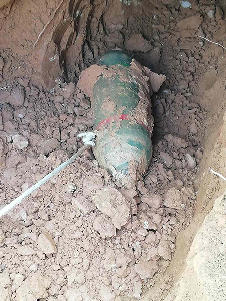 Unexploded ordnance being recovered after attack