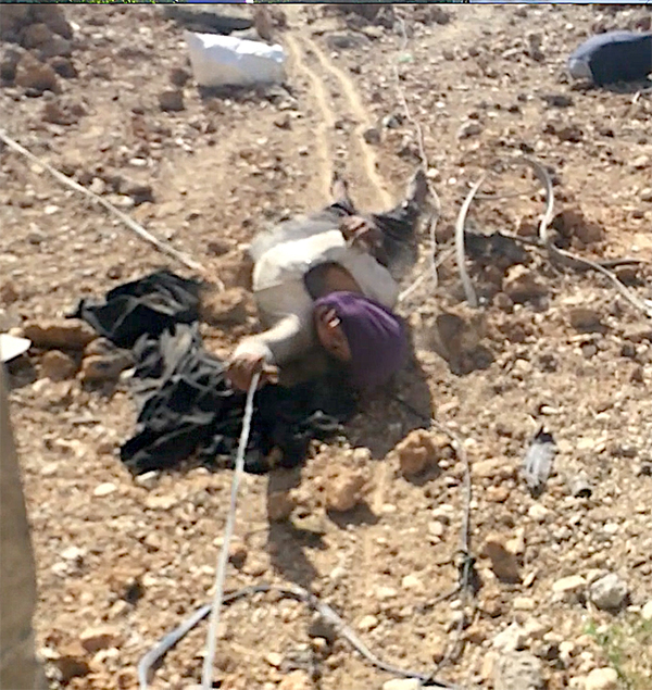 Eman, five days after being shot, as we drag her out of the ISIS controlled Pepsi factory on 3 June 2017.