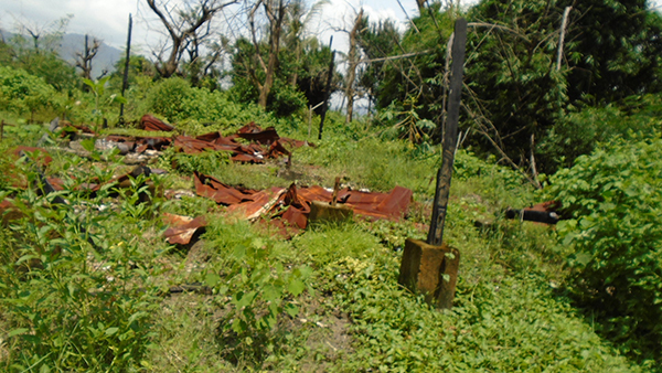 In the village, only a few charred poles remain.